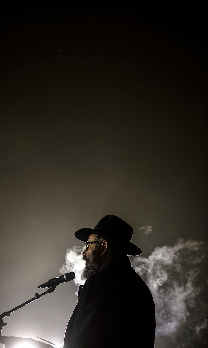 (Steve Griffin  |  The Salt Lake Tribune)  Rabbi Benny Zippel of Chabad Lubavitch is joined by the public as he lights a giant menorah for the first night of Hanukkah, the Jewish eight day festival of lights outside, Abravanel Hall in Salt Lake City Tuesday December 12, 2017.