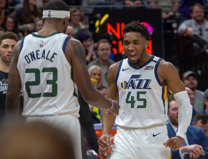 (Rick Egan  |  The Salt Lake Tribune) Utah Jazz guard Donovan Mitchell (45) celebrates after Utah Jazz forward Royce O'Neale (23)stole an inbound pass and was found as he went to the hoop, in NBA action between the Utah Jazz and the Washington Wizards, in Salt Lake City, Friday, February 28, 2020