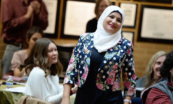 (Francisco Kjolseth  |  The Salt Lake Tribune)  Saja Abbas of Iraq who is studying to learn English, pass her citizenship exam and the GED exam is awarded a certificate of achievement by the Women of the World 8th annual award ceremony at the Salt Lake County building in Salt Lake City on Saturday, Dec. 8, 2018, as a celebration of successes including educational, service, and employment milestones by refugee women.