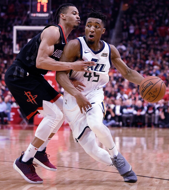 Utah Jazz guard Donovan Mitchell, right, dribbles as Houston Rockets guard Gerald Green defends during the second half in Game 5 of an NBA basketball second-round playoff series, Tuesday, May 8, 2018, in Houston. (AP Photo/Eric Christian Smith)