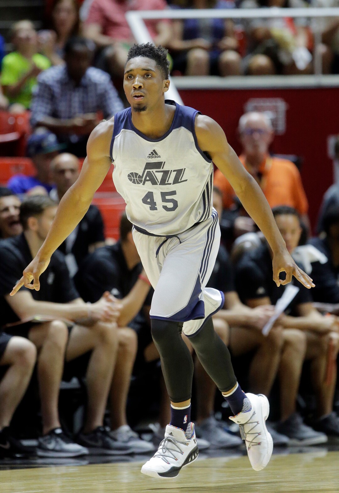 Utah Jazz guard Donovan Mitchell (45) celebrates after scoring a 3-pointer against the San Antonio Spurs during the first half of an NBA summer league basketball game Monday, July 3, 2017, in Salt Lake City. (AP Photo/Rick Bowmer)