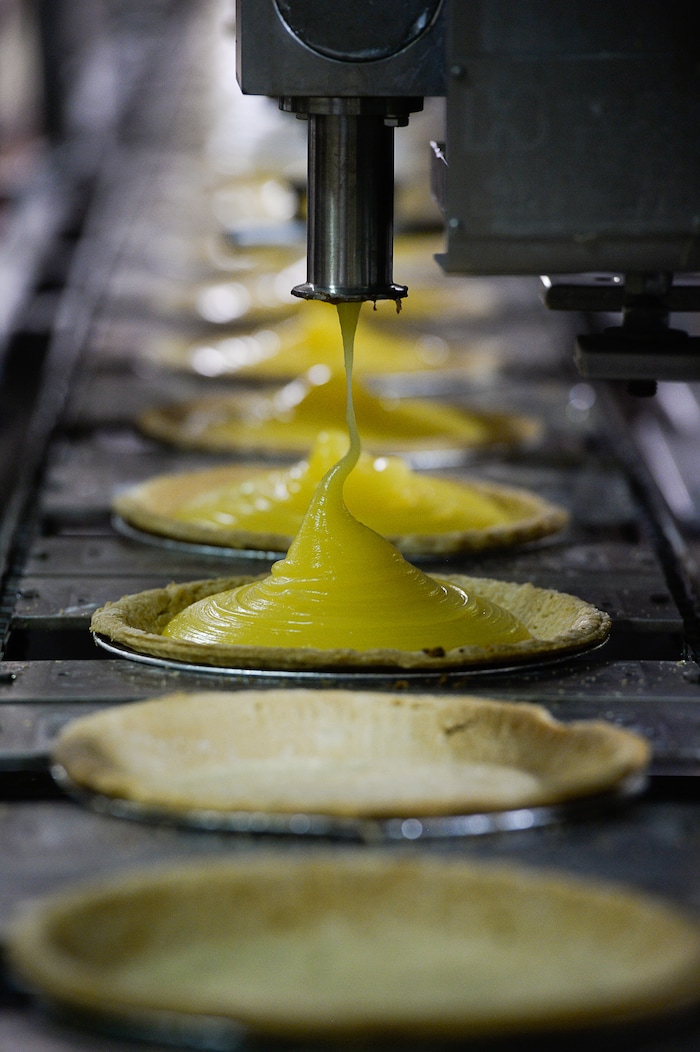 Francisco Kjolseth | The Salt Lake TribuneLemon meringue pies get their filling at Rocky Mountain Pie factory where the pies are made. Some of the winning pie flavors produced include sea salt caramel chocolate, pumpkin chiffon, strawberry margarita, banana cream, peach raspberry galette and cherry almond praline.