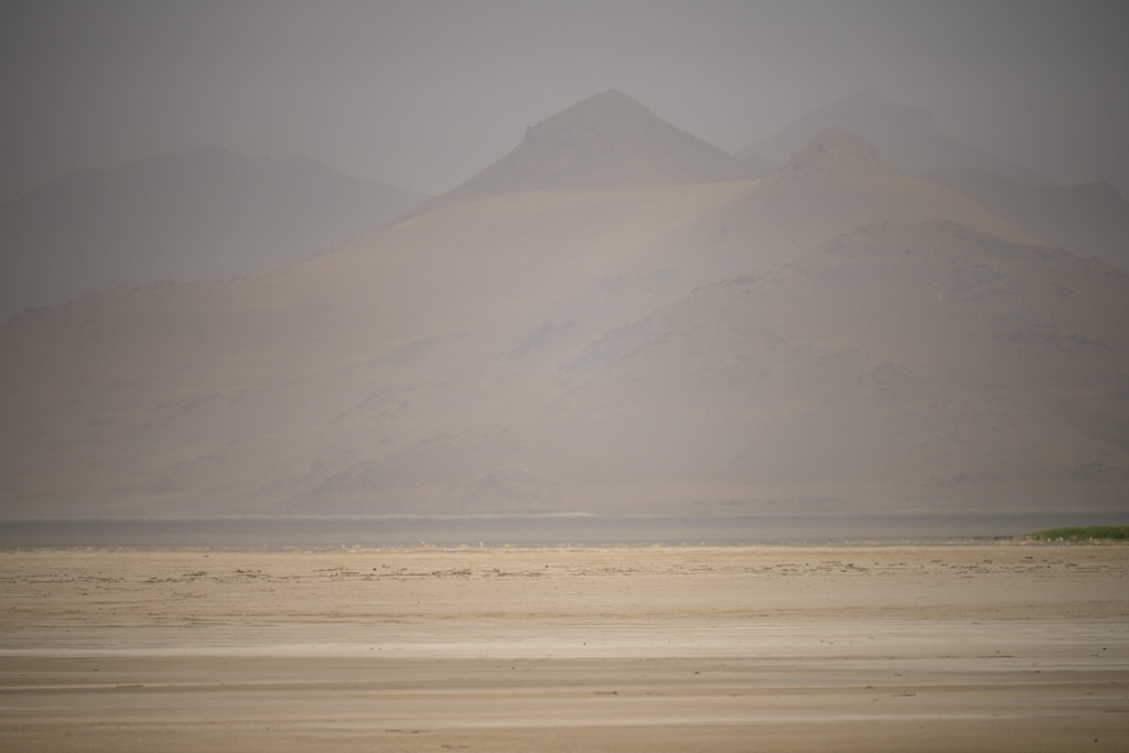 (Trent Nelson  |  The Salt Lake Tribune) Dust obscures Antelope Island and the Great Salt Lake on Saturday, June 18, 2022. The lake has hit another record low.