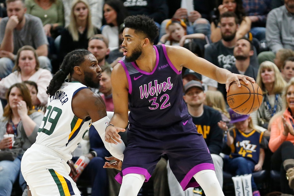 Utah Jazz forward Jae Crowder (99) guards Minnesota Timberwolves center Karl-Anthony Towns (32) in the second half during an NBA basketball game Thursday, March 14, 2019, in Salt Lake City. (AP Photo/Rick Bowmer)