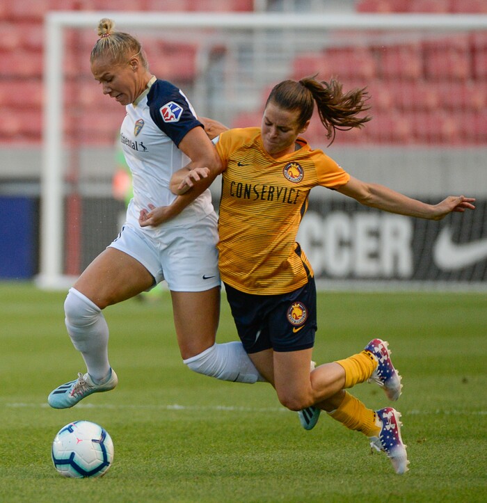 (Francisco Kjolseth  |  The Salt Lake Tribune)  North Carolina Courage defender Merritt Mathias (11) battles Utah Royals FC defender Kelley O'Hara (5) for possession as Utah Royals FC hosts the North Carolina Courage at Rio Tinto Stadium in Sandy, Utah on Saturday, July 27, 2019.