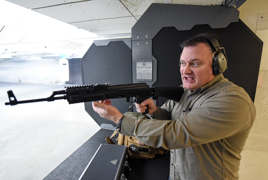 (Francisco Kjolseth  |  The Salt Lake Tribune)  Utah gun rights advocate Clark Aposhian, one of only a handful of Americans who are legally allowed to keep their bump stock, a shooting accessory that alters semi-automatic rifles to fire in quick bursts like a machine gun, demonstrates how it works on an AKM-47 at a gun range in Murray, UT, on Thursday, April 4, 2019. He is challenging the bump stock ban in court, and an appeals court has allowed him to keep his bump stock until his case is resolved in court.