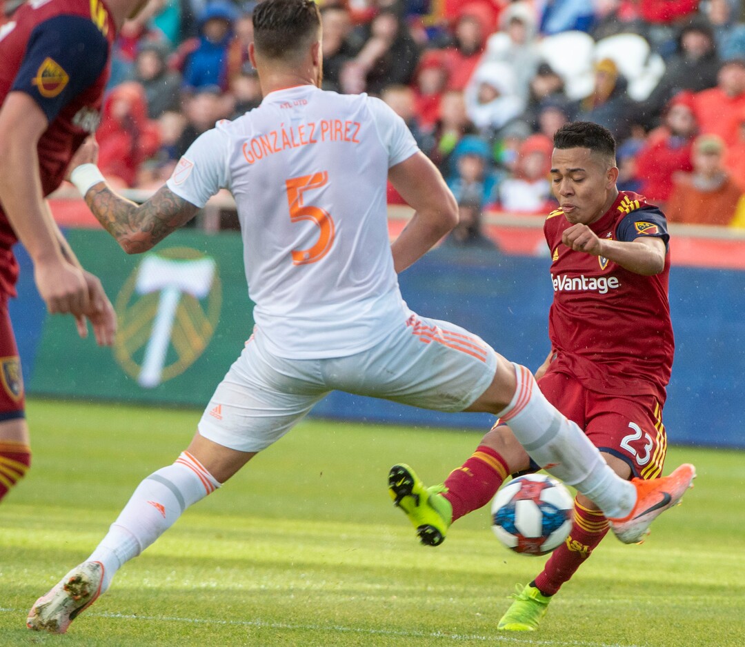 (Rick Egan  |  The Salt Lake Tribune).  Real midfielder Sebastian Saucedo (23) kicks the ball past Atlanta United defender Leandro Gonzalez (5) for a Salt Lake goal, in MLS soccer action between Real Salt Lake and Atlanta United at Rio Tinto Stadium in Sandy, Friday, May 24, 2019.