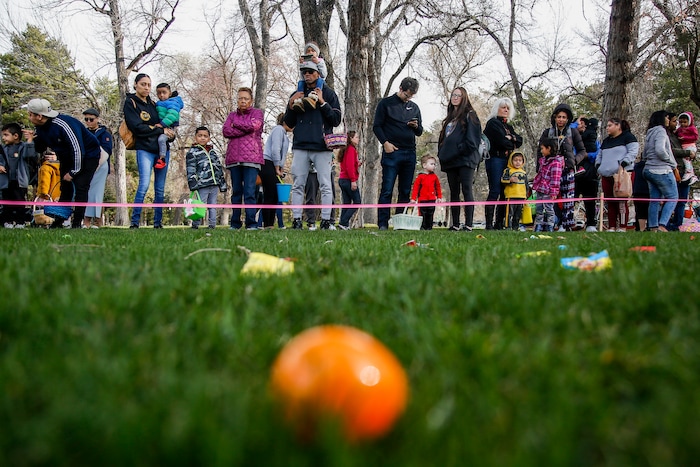(Nicole Boliaux | For The Tribune) Children and their families wait for the stroke of 9 o'clock to begin the annual Easter egg hunt put on by A Kid's Place Dentistry in Liberty Park in Salt Lake City on Saturday, March 31, 2018.