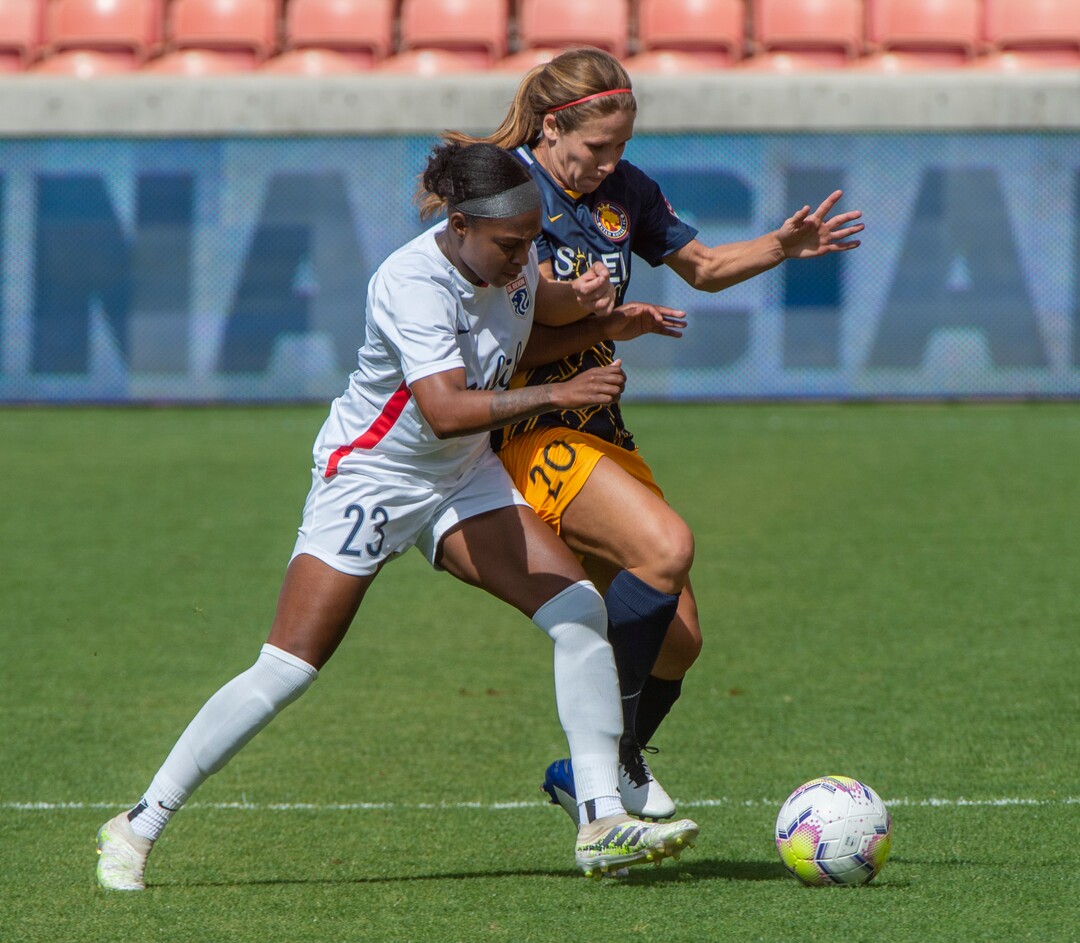 (Rick Egan  |  The Salt Lake Tribune)   OL Reign FC defender Taylor Smith (23) goes for the ball along with Utah Royals FC forward Mallory Weber (20) in soccer action between Utah Royals FC and Ol Reign FC at Rio Tinto Stadium in Sandy, Saturday, Sept. 26, 2020.