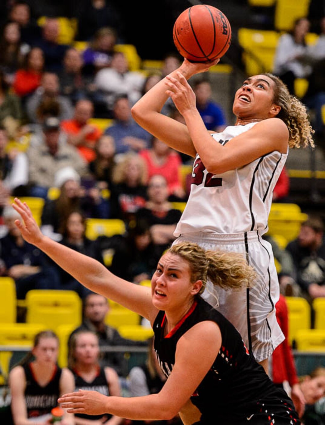 (Trent Nelson | The Salt Lake Tribune)  Hurricane vs. Mountain View, 4A State high school basketball tournament at Utah Valley University in Orem, Thursday March 1, 2018. Mountain View's Skye Lindsay (32) shoots over Hurricane's Kelbie Dayley (23).