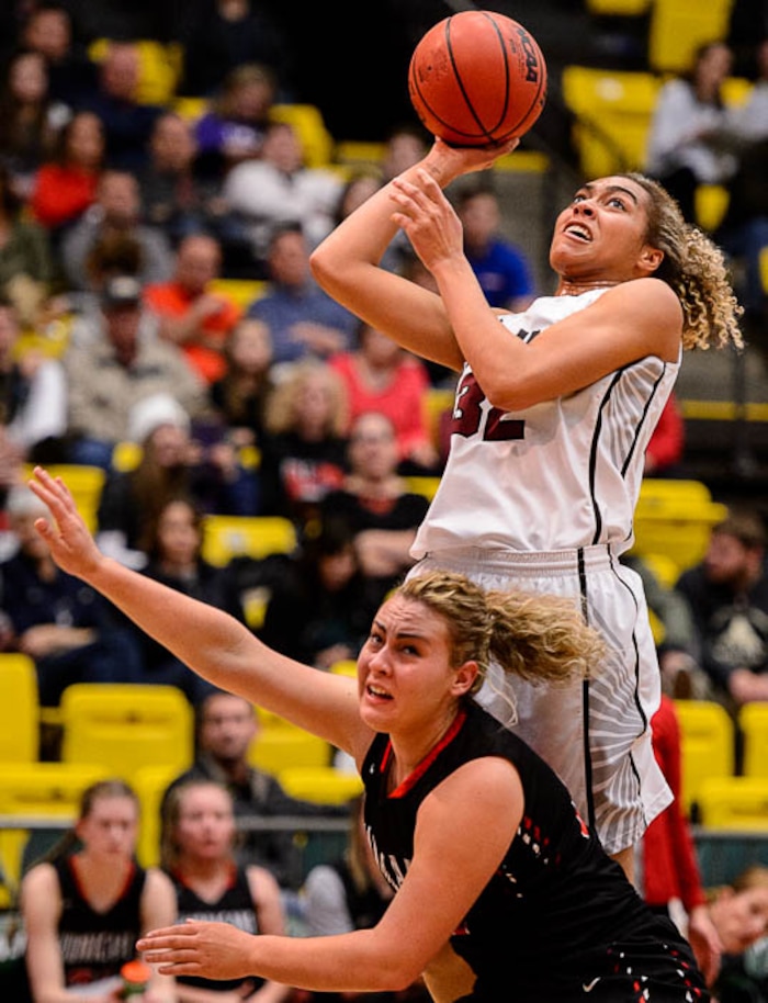 (Trent Nelson | The Salt Lake Tribune)
Hurricane vs. Mountain View, 4A State high school basketball tournament at Utah Valley University in Orem, Thursday March 1, 2018. Mountain View's Skye Lindsay (32) shoots over Hurricane's Kelbie Dayley (23).