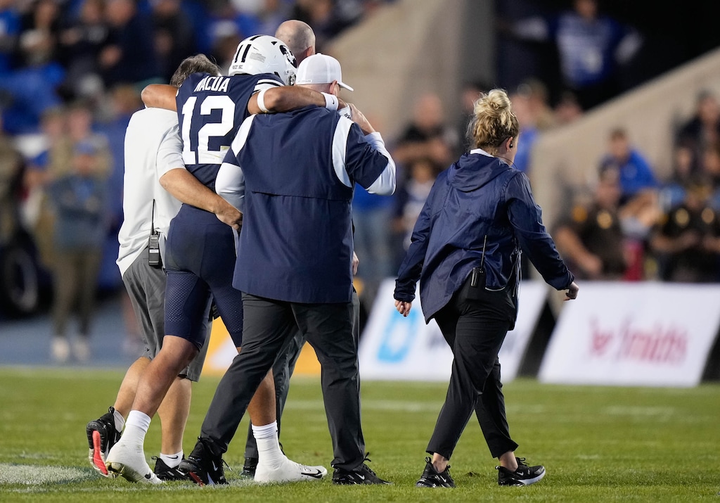 (Francisco Kjolseth | The Salt Lake Tribune) Brigham Young Cougars wide receiver Puka Nacua (12) is helped off the field as the Brigham Young Cougars play the Wyoming Cowboys at LaVell Edwards Stadium in Provo, on Saturday, Sept. 24, 2022.