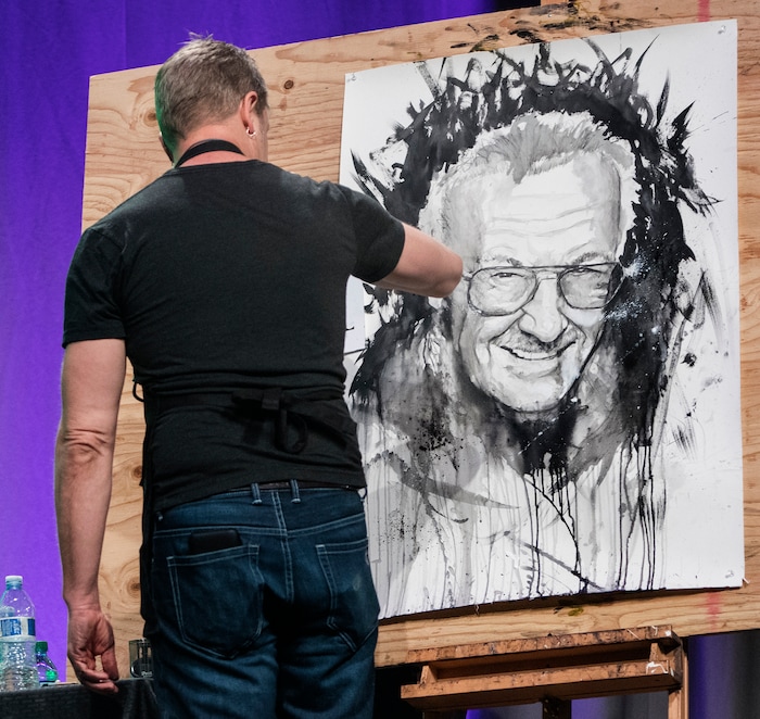 Rick Egan  |  The Salt Lake Tribune

Artist Josh Prior paints a picture of Stan Lee, at the FanX opening, at The Salt Palace Convention Center, Friday, March 17, 2017.


