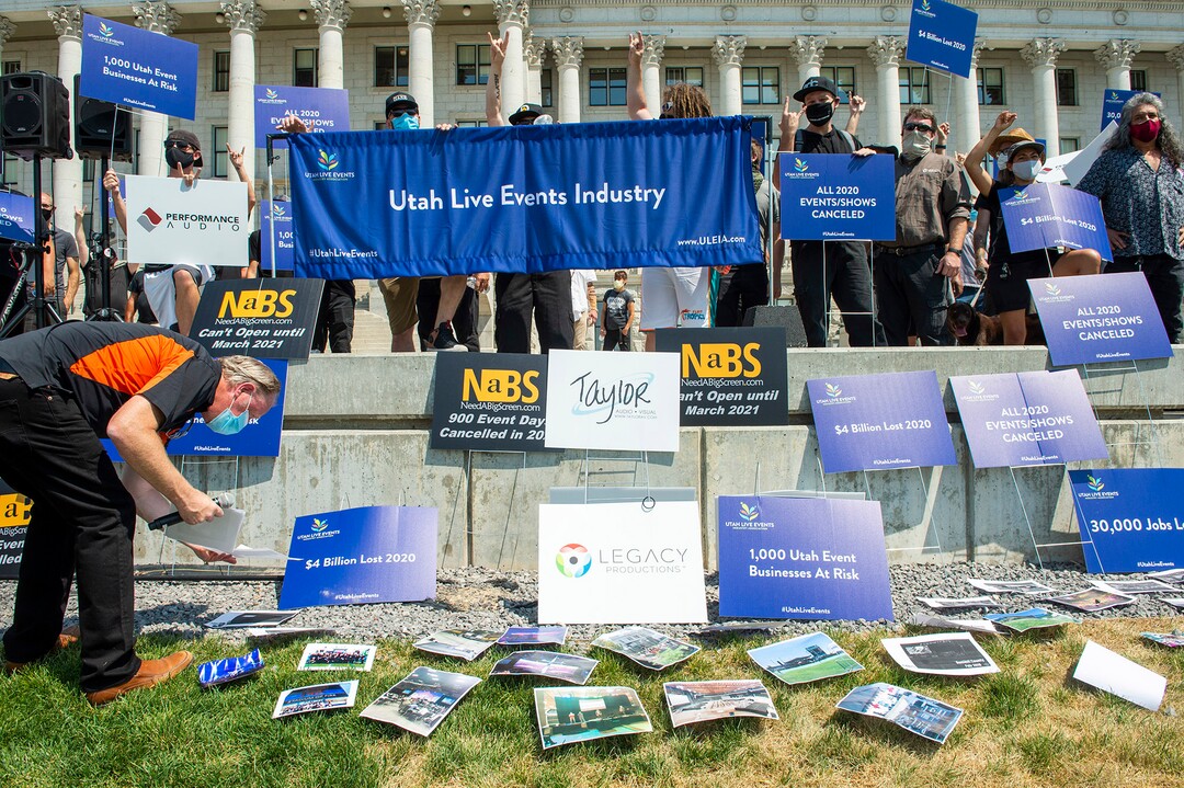 (Rick Egan  |  The Salt Lake Tribune)     Organizer, Peter O'Doherty, puts photos of live events on the grass as members of Utah Live Events Industry Association at a rally at the State Capitol to call attention to the state of their industry, on Tuesday, July 21, 2020.