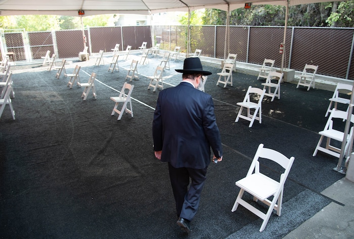 (Francisco Kjolseth  |  The Salt Lake Tribune) Rabbi Benny Zippel goes over safety set up plans with outdoor tents on Thursday, Sept. 17, 2020, for High Holy Day services, which begin Friday evening, so members of Chabad Lubavitch can meet in person, outside and socially distanced through the weekend.
