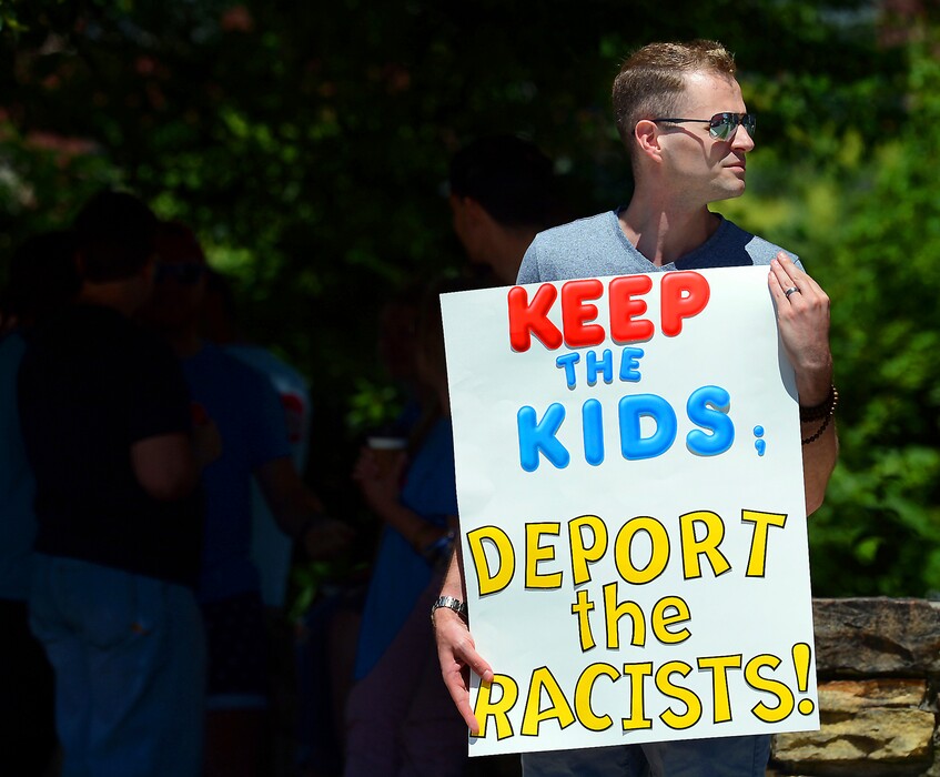 FILE - In this June 15, 2018 file photo, Chris Olson, of Lake Wallenpaupack, Pa., holds a sign outside Lackawanna College where U.S. Attorney Jeff Sessions spoke on immigration policy and law enforcement actions, in Scranton, Pa. The Trump administration's move to separate immigrant parents from their children on the U.S.-Mexico border has turned into a full-blown crisis in recent weeks, drawing denunciation from the United Nations, Roman Catholic bishops and countless humanitarian groups. (Butch Comegys/The Times-Tribune via AP, File)