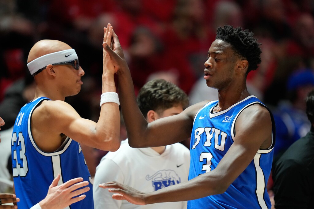(Francisco Kjolseth | The Salt Lake Tribune) BYU Cougars forward AJ Dybantsa (3) and BYU Cougars center Xavion Staton (33) on the sideline as Utah hosts BYU, NCAA basketball in Salt Lake City on Saturday, Jan. 10, 2026.