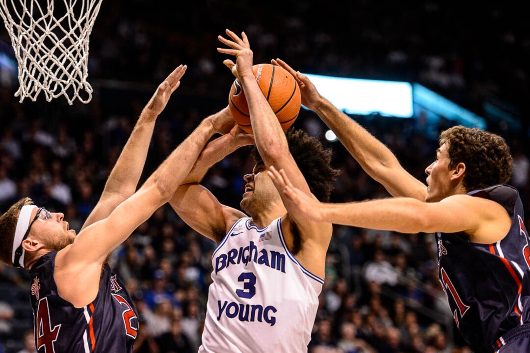 (Trent Nelson | The Salt Lake Tribune)   Brigham Young Cougars guard Elijah Bryant (3) is blocked by St. Mary's Gaels forward Calvin Hermanson (24) as BYU hosts the St. Mary's Gaels, NCAA basketball in Provo, Saturday December 30, 2017.