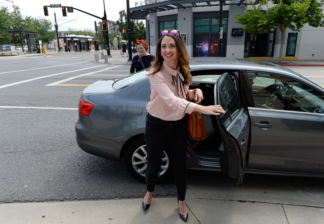 (Francisco Kjolseth  |  The Salt Lake Tribune)  Salt Lake Tribune Digital News Editor Rachel Piper finishes her race against colleagues after taking Lyft during a downtown transportation race from Library Square to the Tribune building at the Gateway on Thursday, Aug. 2, 2018. Modes of transportation included, rentable electric scooters, Green Bike, TRAX, Lyft, and walking.