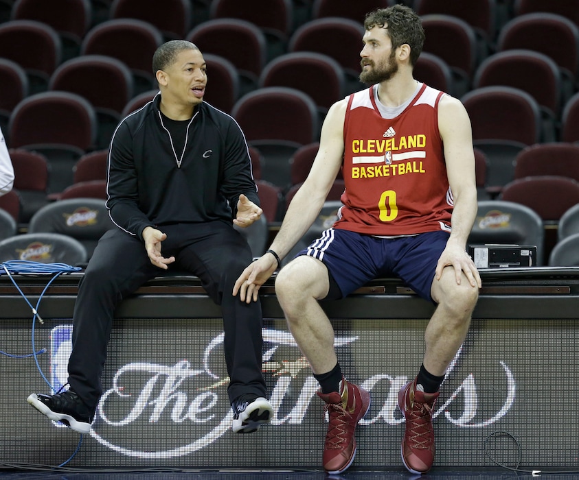 Cleveland Cavaliers head coach Tyronn Lue, left, talks with Kevin Love during practice for Game 6 of the NBA basketball Finals, Wednesday, June 15, 2016, in Cleveland. The Cavaliers will play the Golden State Warriors Thursday night in Cleveland. (AP Photo/Tony Dejak)