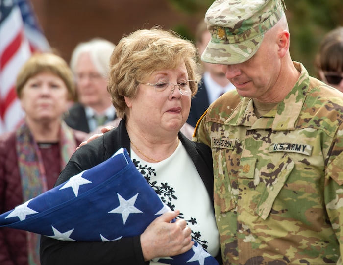 (Rick Egan  |  The Salt Lake Tribune)     Jon Richardson, Major with Utah National Guard, comforts Mary Ann Turner, the daughter of 2nd Lt. Lynn W. Hadfield, after the graveside service for her father, who was killed during the Second World War, at Veterans Memorial Park, in Bluffdale. Thursday, March 21, 2019.



