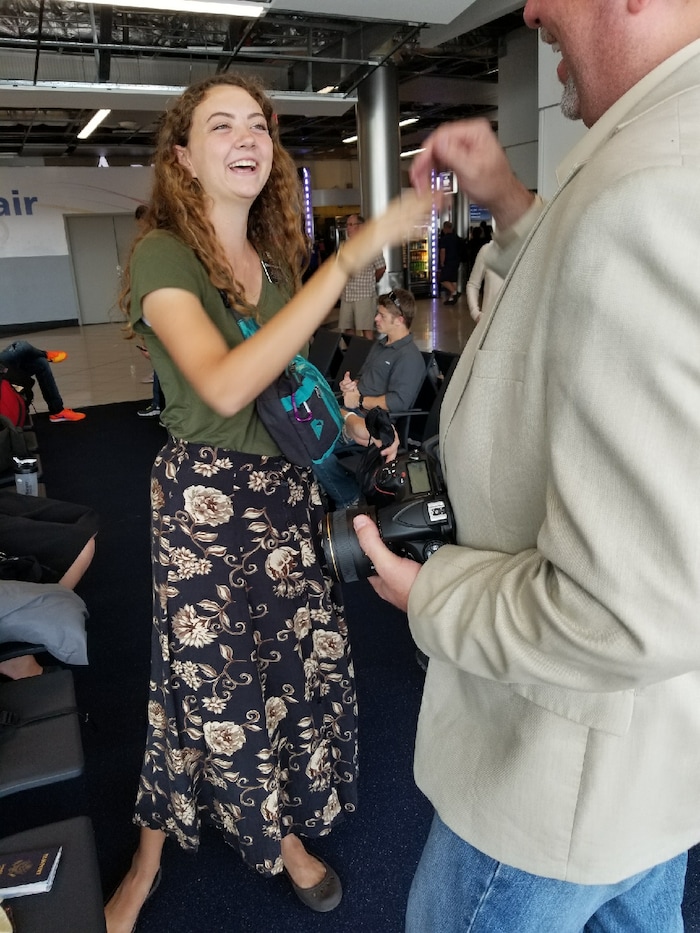 Courtesy | Michael McDonald. Mormon missionary Erin McDonald meets by chance with her parents at the Atlanta airport while evacuating from Puerto Rico on September 23, 2017.