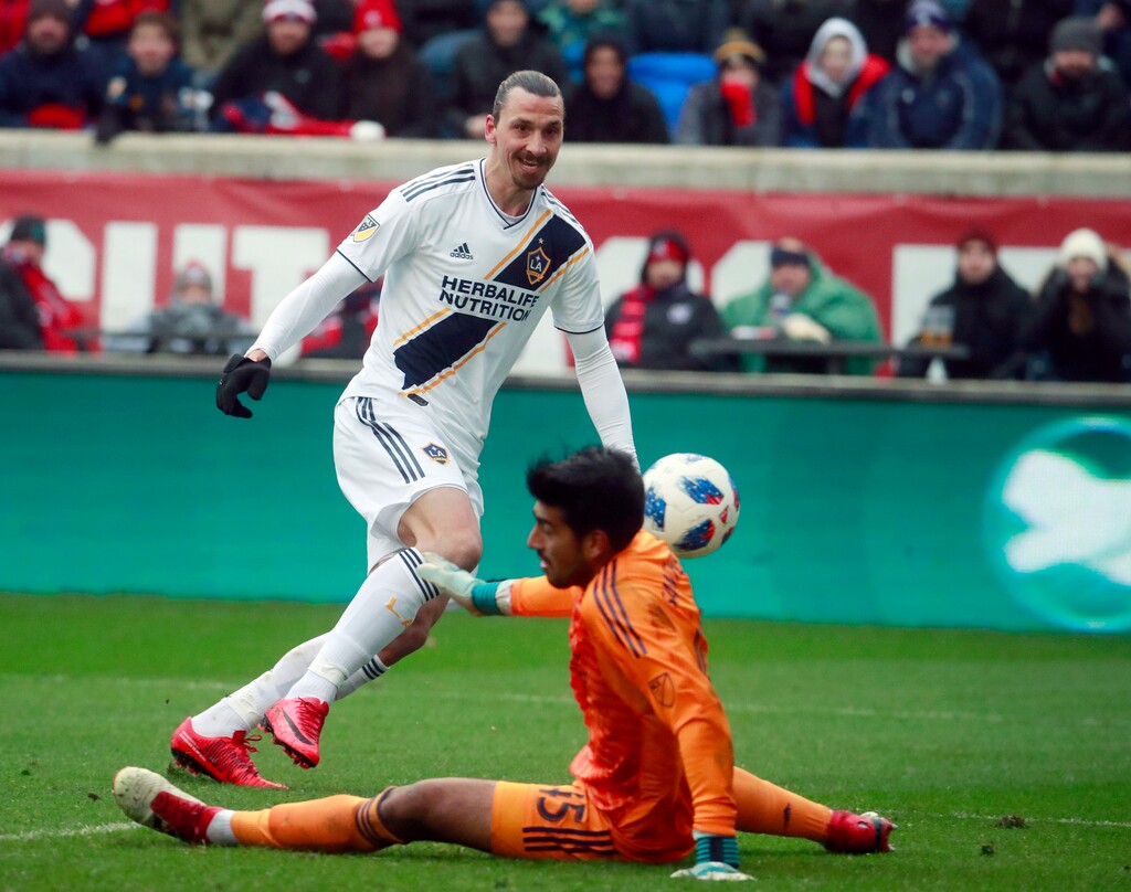 Chicago Fire goalkeeper Richard Sanchez (45), makes a save on a shot at close range by Los Angeles Galaxy forward Zlatan Ibrahimovic (9), during the first half of an MLS soccer match in Bridgeview, Ill., on Saturday, April 14, 2018. (Nuccio DiNuzzo/Chicago Tribune via AP)
