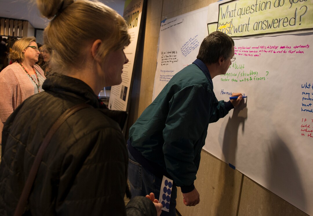 (Leah Hogsten  |  The Salt Lake Tribune) "How much input will people experiencing homelessness have with how the shelters are operated?" asked David Holland, right, writing his question to be answered by city leaders.  Salt Lake City community leaders and service providers hosted a public forum, Tuesday, September 26, 2017 to present preliminary designs and programming for the two new Homeless Resource Centers to be located at 131 E 700 S and 275 W High Ave. in Salt Lake City.