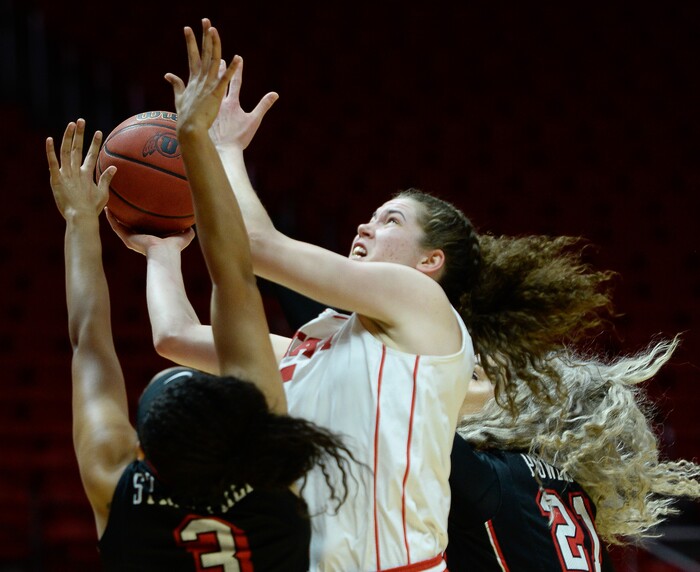 (Francisco Kjolseth  |  The Salt Lake Tribune)  Utah Utes center Megan Huff (5) drives the ball as Utah hosts UNLV in women's NCAA basketball at the Huntsman Center, Thursday, March 15, 2018.