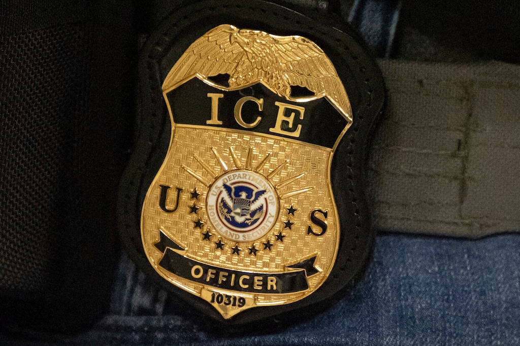 (Yuki Iwamura | AP) A federal agent wears an Immigration and Customs Enforcement badge in New York, June 10, 2025.