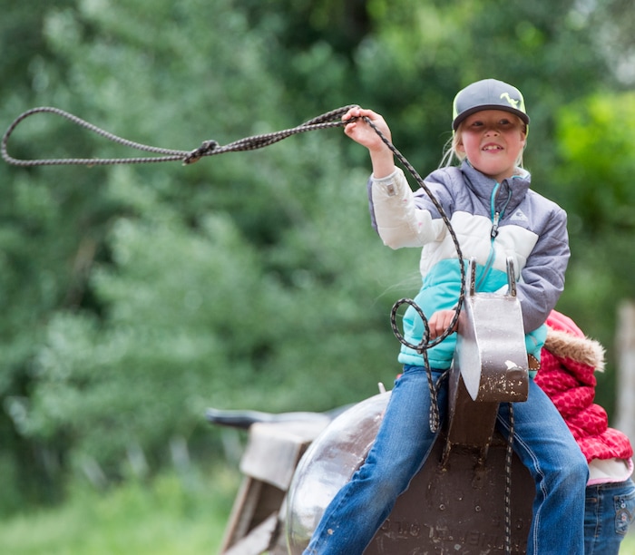 (Rick Egan  |  The Salt Lake Tribune)   at Sadie Penstra, 8, from Hooper, practices her roping skills, the 13th Annual Cowboy Legends, Music & Poetry Festival at the Historic Fielding Garr Ranch on Antelope Island, Sunday, May 27, 2018. The Festival continues through Monday.