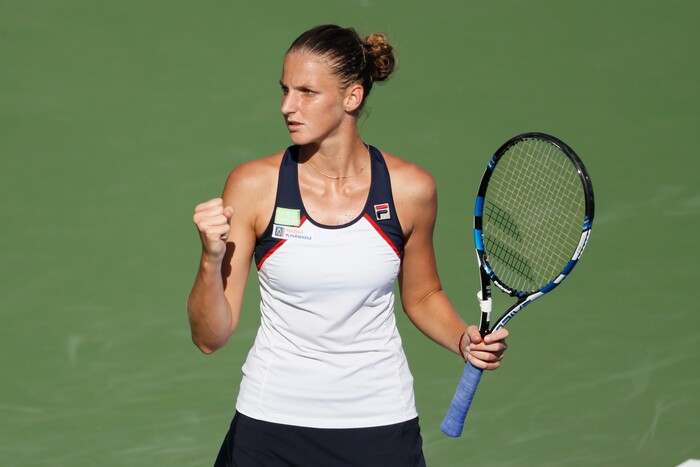 Karolina Pliskova, of the Czech Republic, reacts during a match against Caroline Wozniacki, of Denmark, at the Western & Southern Open tennis tournament, Friday, Aug. 18, 2017, in Mason, Ohio. (AP Photo/John Minchillo)
