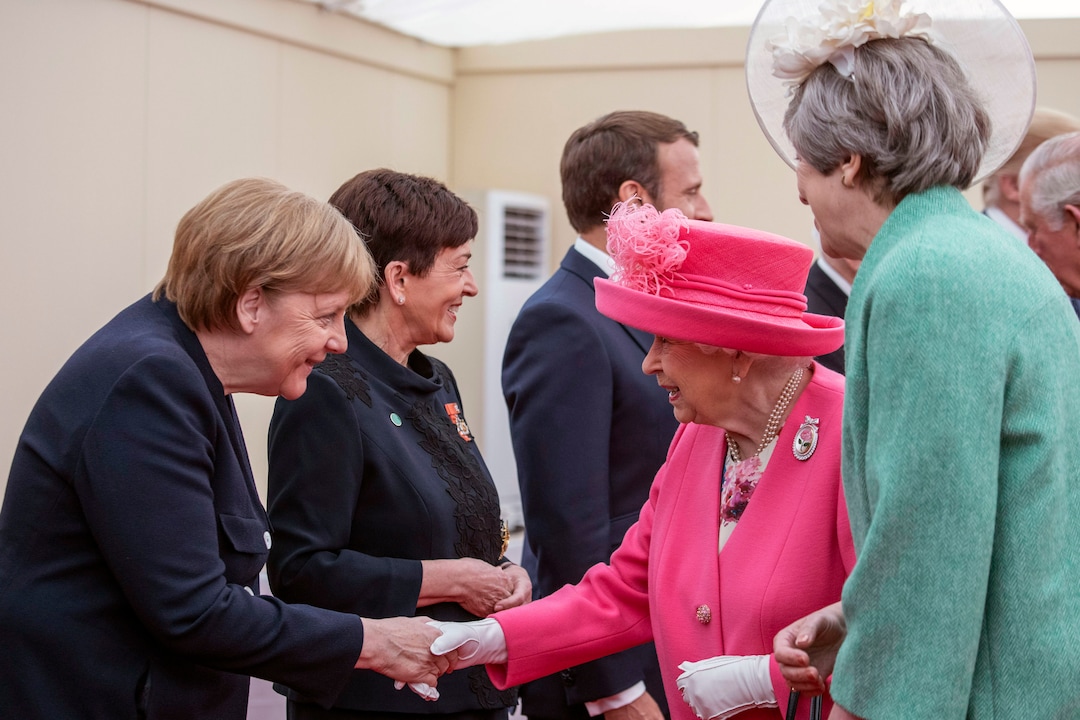 (Jack Hill | Pool via AP) Leaders from left, German Chancellor Angela Merkel, Governor-General of New Zealand Patsy Reddy, President of France Emmanuel Macron, with Britain's Queen Elizabeth II and Prime Minister Theresa May, during a meeting of the Allied Nations at the 75th Anniversary of the D-Day landings, in Portsmouth, England, Wednesday June 5, 2019. Commemoration events are marking the 75th Anniversary of the D-Day landings when Allied forces stormed the beaches of Normandy in northern France during World War II.