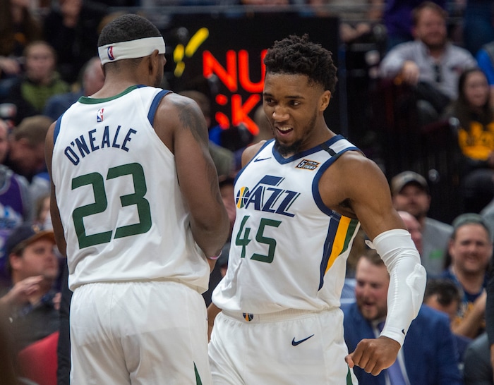 (Rick Egan  |  The Salt Lake Tribune) Utah Jazz guard Donovan Mitchell (45) celebrates after Utah Jazz forward Royce O'Neale (23)stole an inbound pass and was found as he went to the hoop, in NBA action between the Utah Jazz and the Washington Wizards, in Salt Lake City, Friday, February 28, 2020