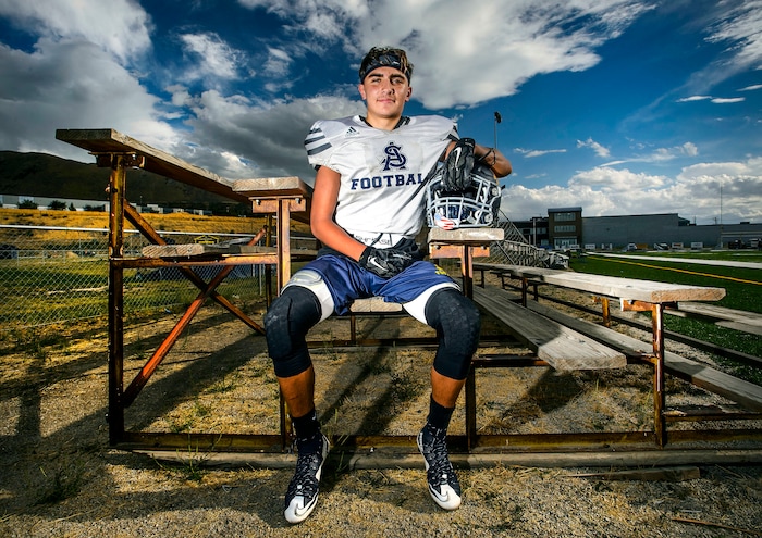 (Steve Griffin  |  The Salt Lake Tribune)  Summit Academy's Gavin Davey sits on a wooden bleacher on the school's football field in Bluffdale, Utah Wednesday September 13, 2017.