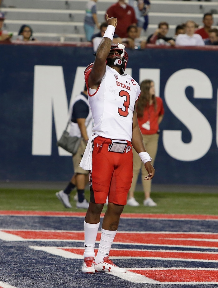Utah quarterback Troy Williams (3) celebrates after scoring a touchdown against Arizona in the second half during an NCAA college football game, Friday, Sept. 22, 2017, in Tucson, Ariz. Utah defeated Arizona 30-24. (AP Photo/Rick Scuteri)
