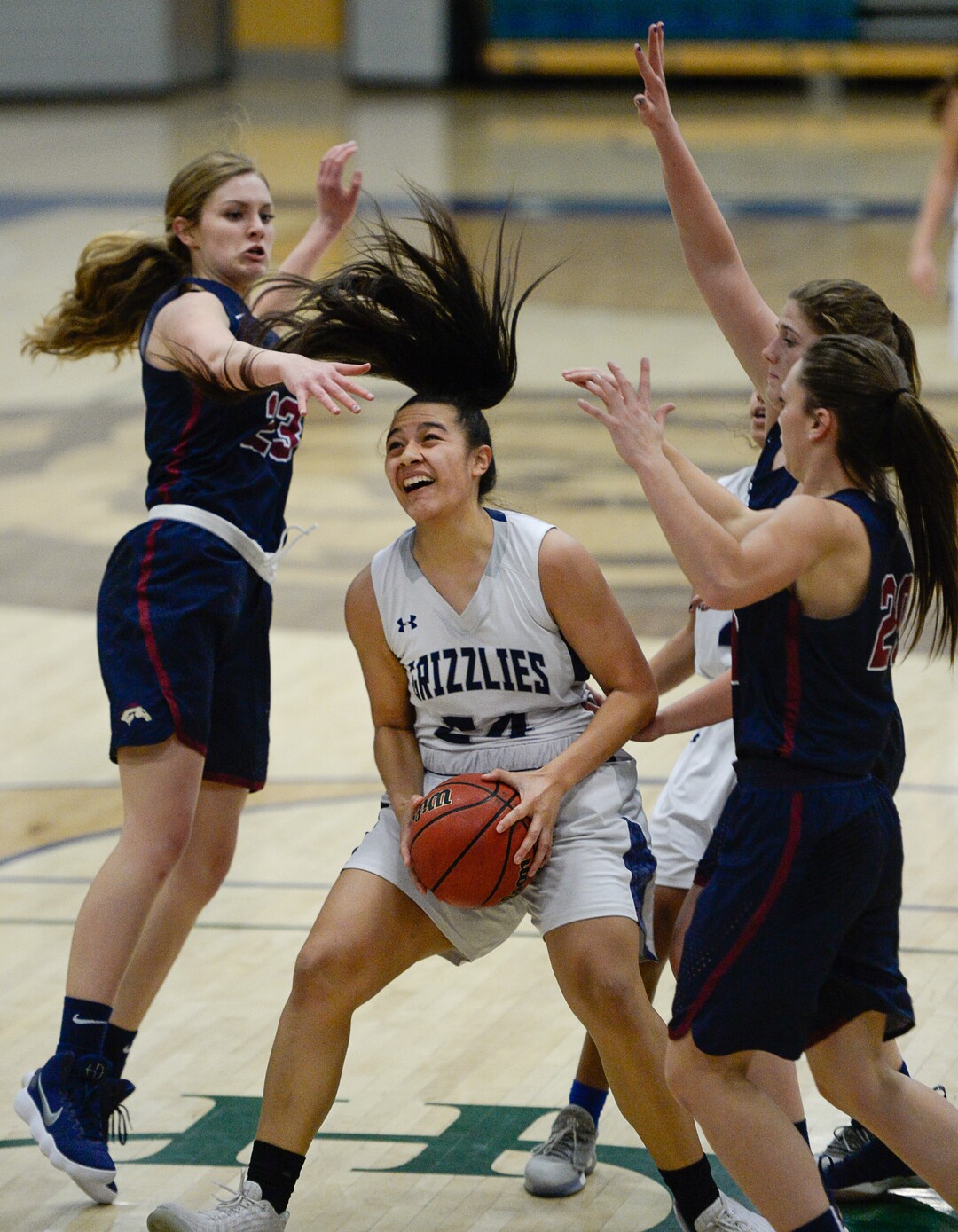 (Francisco Kjolseth  |  The Salt Lake Tribune)  Copper Hills Laci Olsen is pressured on all sides by Herriman in the second half of their game in West Jordan on Thursday, Jan. 25, 2018.