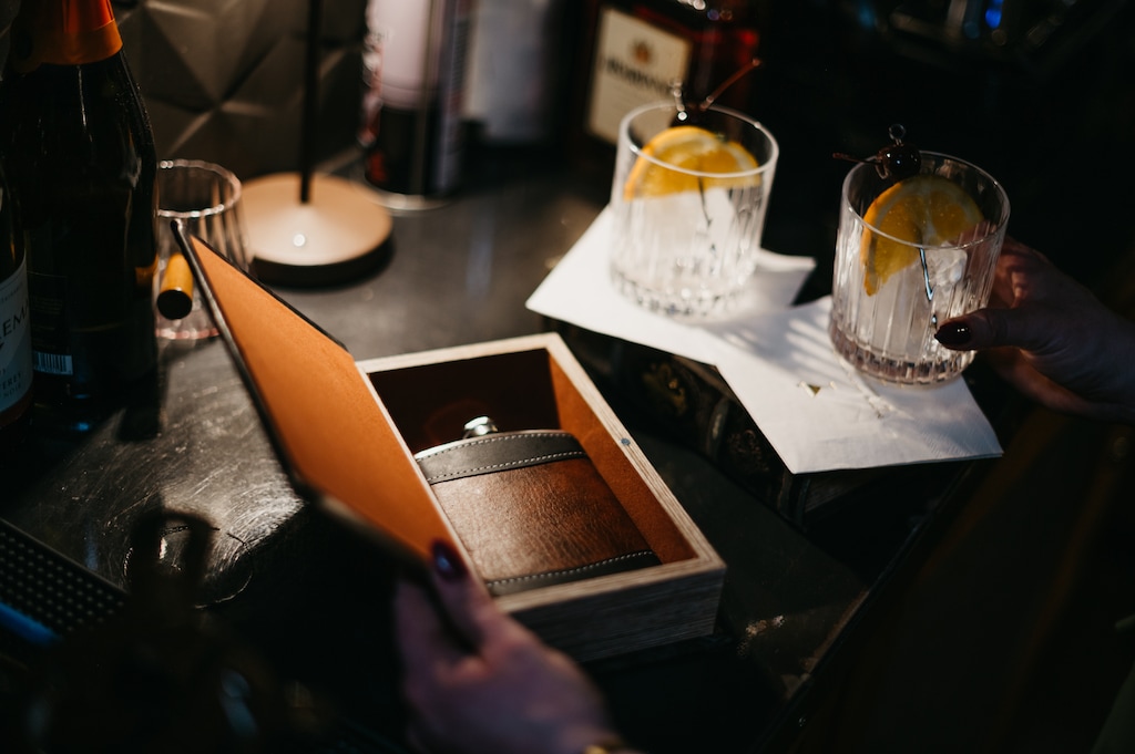 (Book Club Bistro) An old fashion cocktail, which is secreted inside a flask hidden in a hollow book, at the Book Club Bistro in St. George.