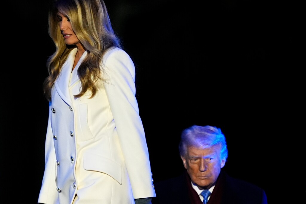 First lady Melania Trump and President Donald Trump arrive on stage for the lighting of the National Christmas Tree on the Ellipse, Thursday, Dec. 4, 2025, near the White House in Washington. (AP Photo/Julia Demaree Nikhinson)