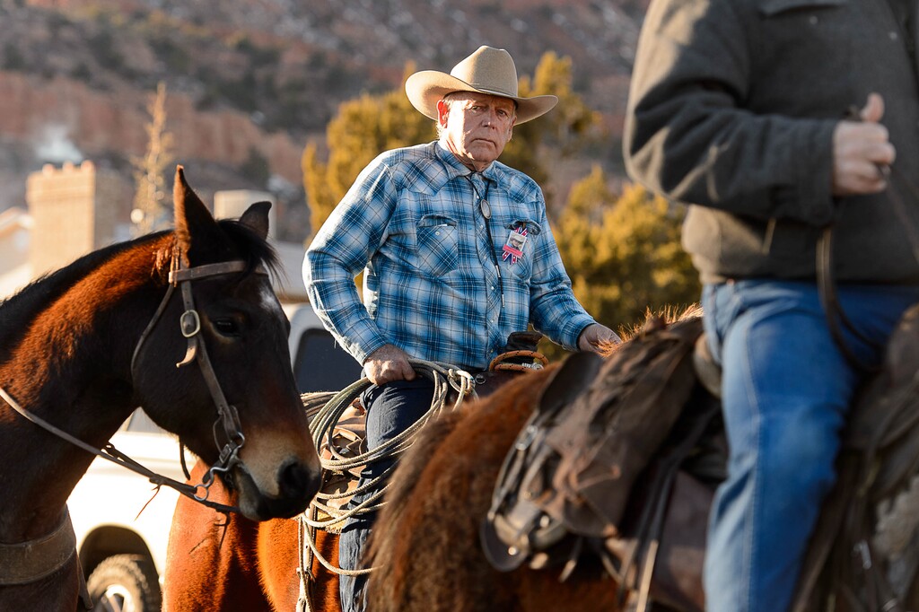 (Trent Nelson | The Salt Lake Tribune) Cliven Bundy rides in a procession at the funeral for Robert "LaVoy" Finicum, in Kanab on Friday, Feb. 5, 2016.