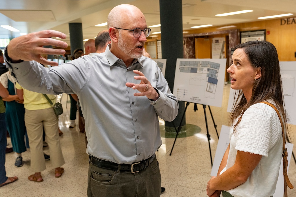 (Rick Egan | The Salt Lake Tribune) Architect Eric Madsen goes over the newly unveiled plans for Highland High School with Jessica Wood during an open house on Monday, Sept. 8, 2025.