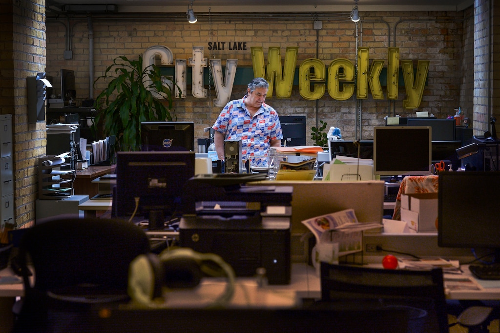 (Leah Hogsten | The Salt Lake Tribune) The City Weekly owner and publisher John Saltas stands in an empty newsroom, April 1, 2020. Saltas 12 staffers are work remotely from home amid the coronavirus social distancing protocols. Saltas institutited furloughs on his staff March 27, and estimates the editorial staff is about half of what it was at its peak.The COVID-19 pandemic is wreaking havoc on many small news-gathering organizations, such as alt-weeklies and free community newspapers.