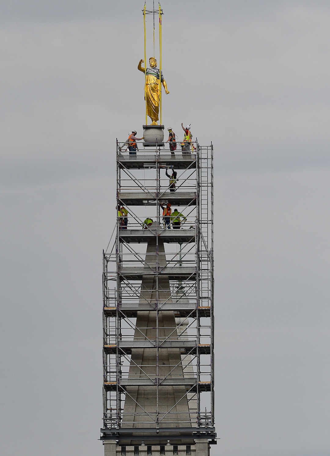 (Francisco Kjolseth  |  The Salt Lake Tribune) Crews work to remove the Angel Moroni statue atop the Salt Lake Temple of The Church of Jesus Christ of Latter-day Saints on Monday, May 18, 2020. The temple closed in December for seismic upgrades and sustained minor damager during the March 18, 2020, magnitude 5.7 earthquake when the trumpet held by the angel fell off and several smaller spire stones were displaced.