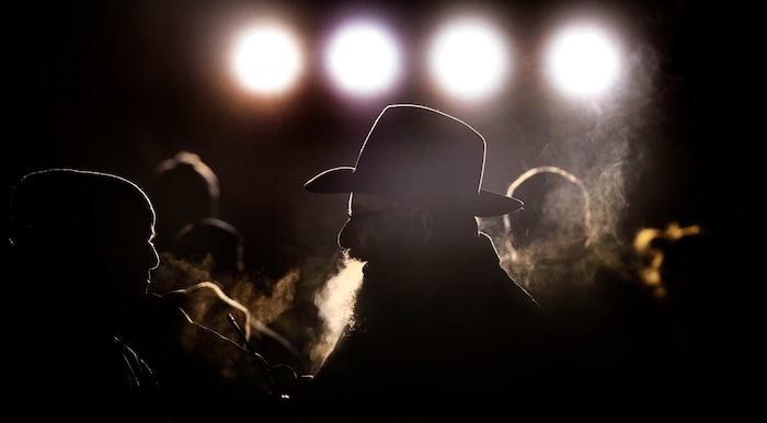 (Steve Griffin  |  The Salt Lake Tribune)  Rabbi Benny Zippel of Chabad Lubavitch is joined by the public as he lights a giant menorah for the first night of Hanukkah, the Jewish eight day festival of lights outside, Abravanel Hall in Salt Lake City Tuesday December 12, 2017.