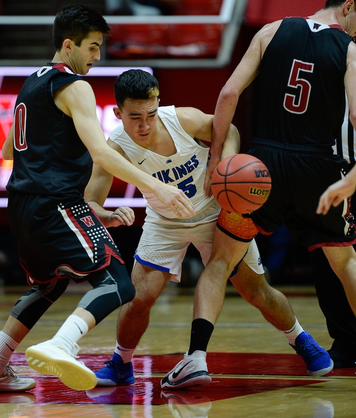 (Francisco Kjolseth  |  The Salt Lake Tribune)  Weber vs Pleasant Grove, 6A State high school basketball tournament at the Huntsman Center in Salt Lake City, Thursday March 1, 2018. Pleasant Grove's Kainoa Maldonado, center.  loses control of the ball against Weber. 