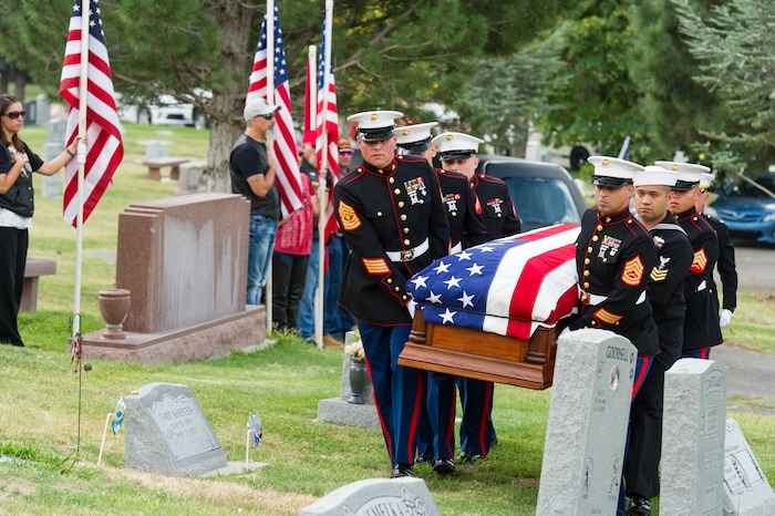 (Alex Gallivan  |  Special to The Tribune) Marine Pfc. Robert K. Holmes, who died 77 years ago aboard the USS Oklahoma during the attack on Pearl Harbor, is laid to rest in the Salt Lake City Cemetery, Monday, Aug. 20, 2018.