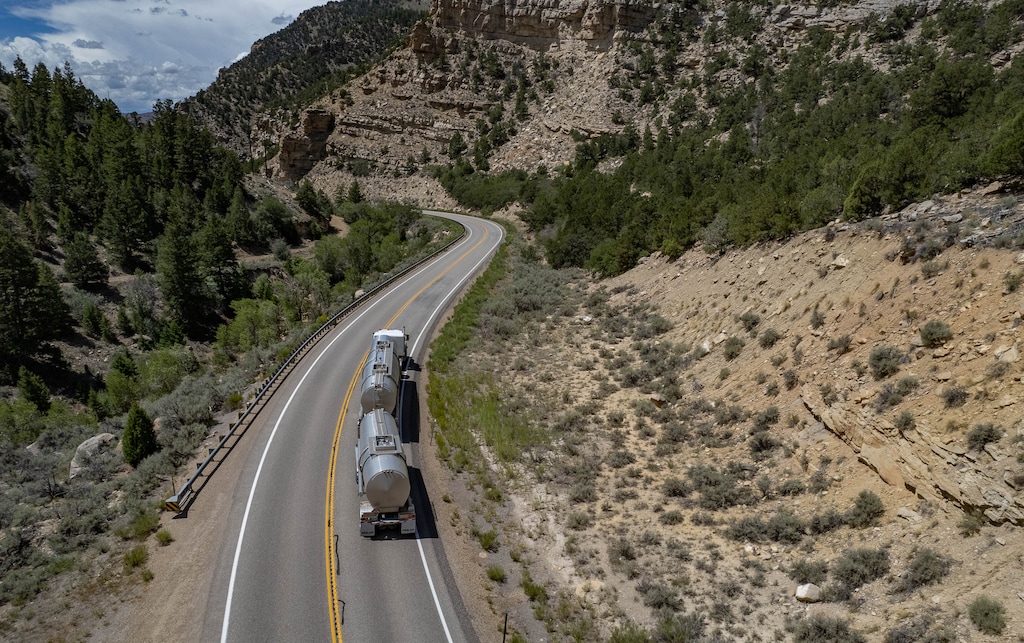 (Francisco Kjolseth | The Salt Lake Tribune) Tanker trucks carry oil through Utah’s Indian Canyon on U.S. Highway 191 on Aug. 5, 2022 from the Uinta Basin to the Wildcat Loadout, now controlled by Finley Resources, a Texas-based oil producer. The old coal-handling facility outside Helper has been repurposed for transloading oil that is ultimately shipped to Gulf Coast refineries. Finley is moving more than 20,000 barrels a day through the loadout, which it plans to expand to handle 100.000 barrels.