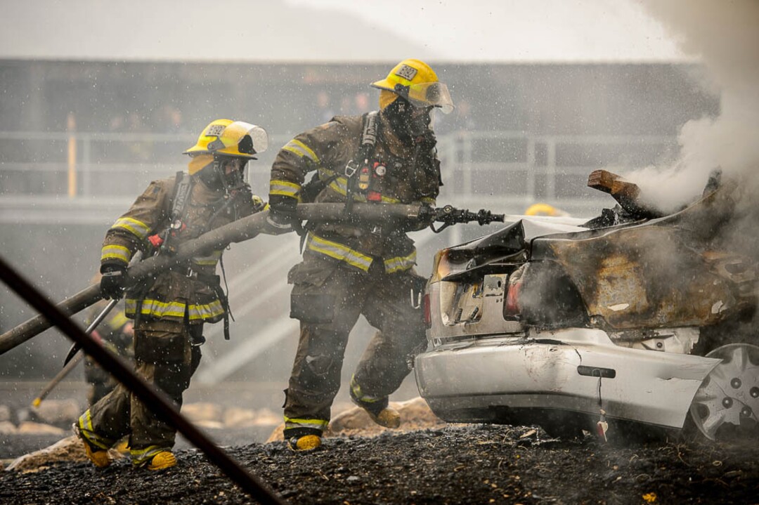 (Trent Nelson  |  The Salt Lake Tribune)  Unified Fire recruits in a live response to a vehicle and structure fire at the Unified Fire Authority Training Center in Magna on Tuesday April 16, 2019.