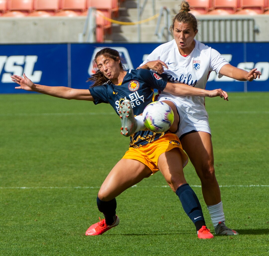 (Rick Egan  |  The Salt Lake Tribune) Utah Royals FC forward Raisa Strom-Okimoto collides with Seattle Reign FC forward Shea Groom (2), in soccer action between Utah Royals FC and Ol Reign FC at Rio Tinto Stadium in Sandy, Saturday, Sept. 26, 2020.