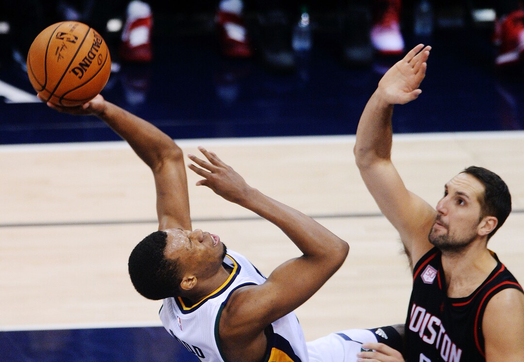 Steve Griffin / The Salt Lake TribuneUtah Jazz guard Rodney Hood (5) falls back in pain as he gets hit in the face as he drives to the basket during the Utah Jazz versus Houston Rockets NBA game at Vivint Smarthome Arena in Salt Lake City Tuesday November 29, 2016. 